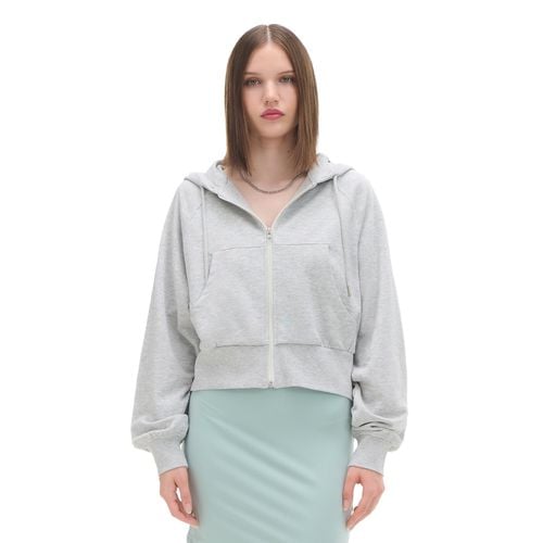 Top da jogging con zip e cappuccio - Cropp - Modalova