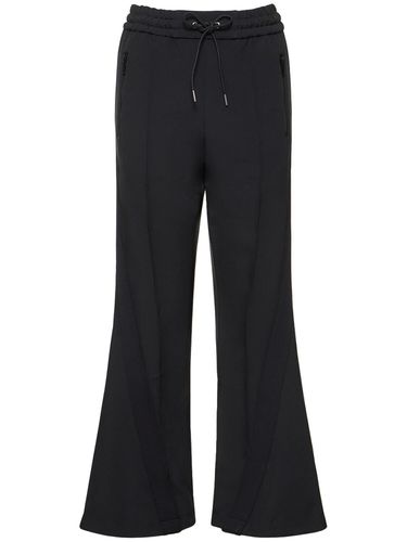 Pantaloni Larghi Jogger In Techno Jersey - SACAI - Modalova