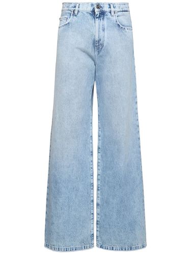 Jeans Anchos De Denim Lavados Con Piedra - VERSACE - Modalova