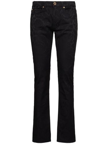 Baroque Jacquard Denim Jeans - VERSACE - Modalova