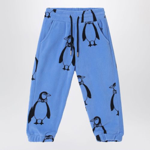 Blue jogging trousers with penguins - Mini Rodini - Modalova