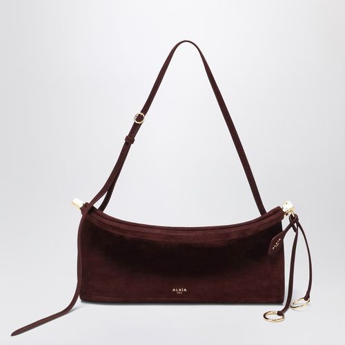 Le Click East West medium bag in garnet red nubuck - Alaïa - Modalova