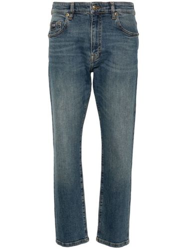 Jean slim à logo brodé - Versace Jeans Couture - Modalova