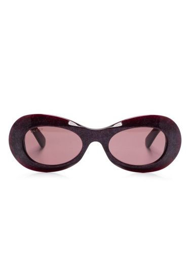 Lunettes de soleil à monture ovale - Gucci Eyewear - Modalova