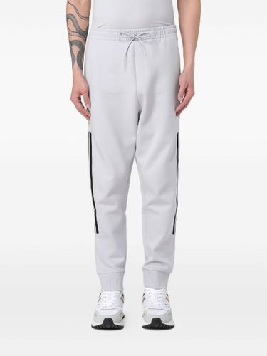 Pantalon de jogging à détails rayés - HUGO - Modalova