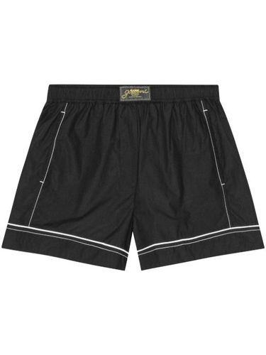 GANNI short à patch logo - Noir - GANNI - Modalova