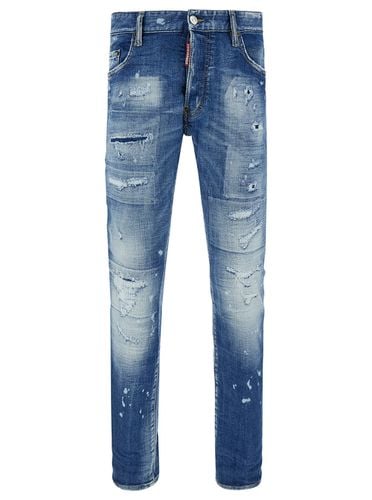 Slim Jeans With Rips And Bleach Effect In Cotton Blend Denim Man - Dsquared2 - Modalova