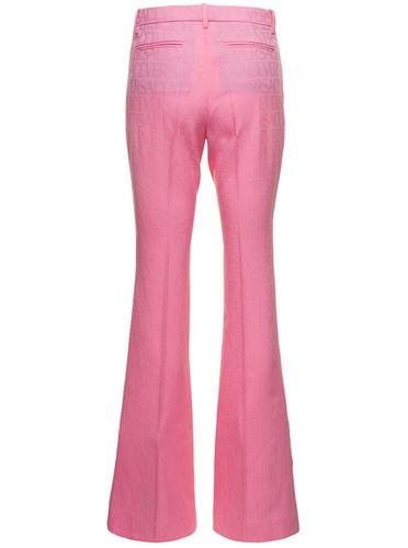 Flare Pants With Tonal Logo Lettering In Wool Woman - Versace - Modalova