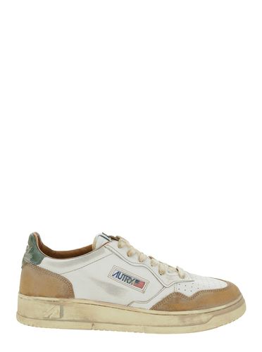 Super Vintage Low Top Sneakers With Logo Detail In Leather And Suede Man - Autry - Modalova