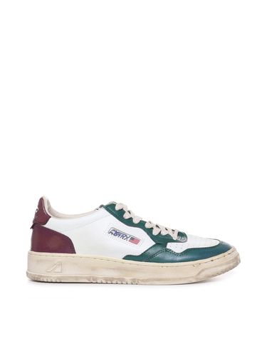 Super Vintage Sneakers In Used Leather - Autry - Modalova