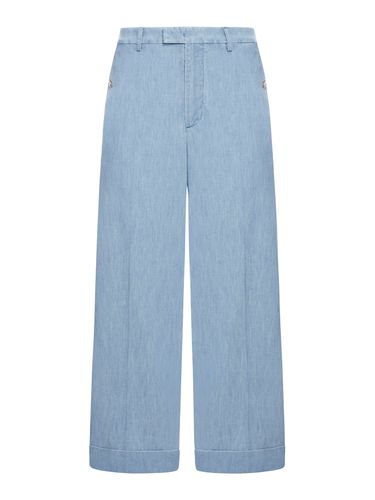 DENIM TROUSERS WITH TURN-UP - Man - Valentino Garavani - Modalova