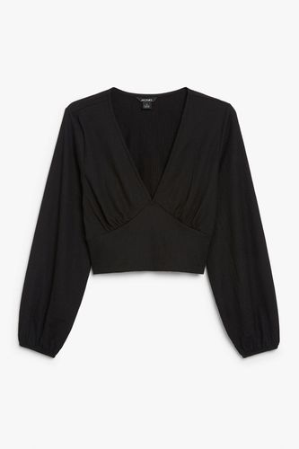 Bluse mit tiefem V-Ausschnitt Schwarz, Blusen in Größe XXS. Farbe: - Monki - Modalova