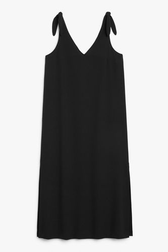 Trägerkleid mit V-Ausschnitt schwarz Schwarz, Alltagskleider in Größe XXS. Farbe: - Monki - Modalova