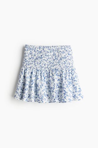 Gesmokter Minirock Weiß/Blau geblümt, Röcke in Größe L. Farbe: - H&M - Modalova