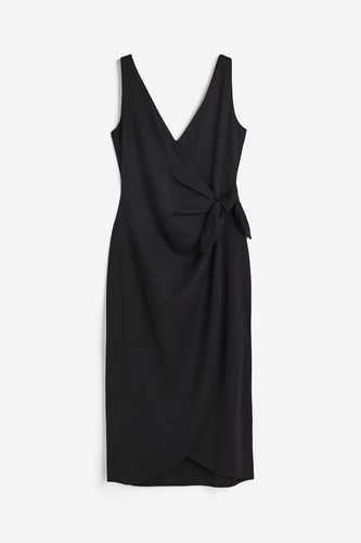 Wickelkleid mit V-Ausschnitt Schwarz, Alltagskleider in Größe XS. Farbe: - H&M - Modalova