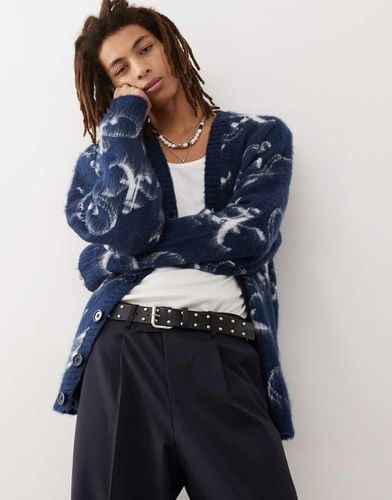 Cardigan oversize soffice in maglia con logo - Collusion - Modalova