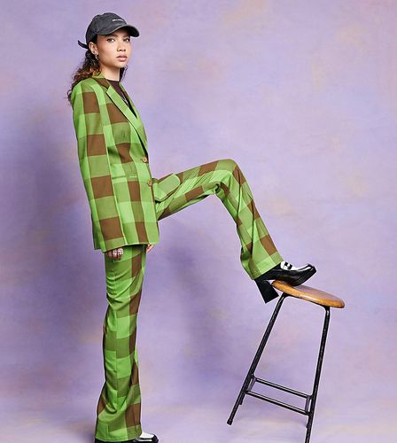 Pantaloni a zampa a quadri verdi e marroni - Collusion - Modalova