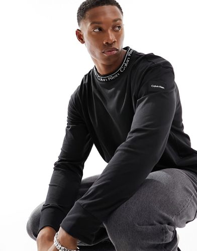 Maglietta unisex nera a maniche lunghe con logo - Calvin Klein - Modalova