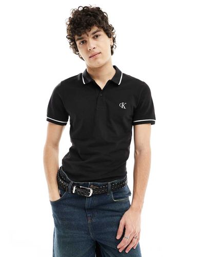 Polo slim nera con bordi a contrasto - Calvin Klein Jeans - Modalova