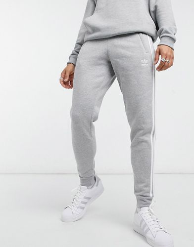 Adicolor - Joggers skinny con tre strisce, colore mélange - adidas Originals - Modalova