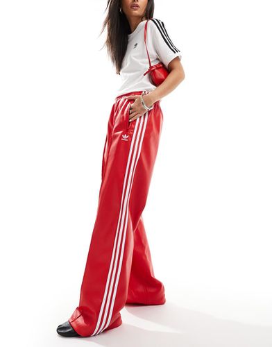 Firebird - Pantaloni sportivi rossi in pelle sintetica - adidas Originals - Modalova