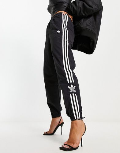 Lock Up - Pantaloni sportivi neri con le tre strisce - adidas Originals - Modalova