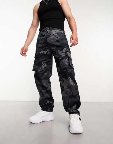 Pantaloni cargo neri mimetici - adidas Originals - Modalova