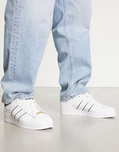 Superstar - Sneakers bianche con strisce a contrasto - adidas Originals - Modalova