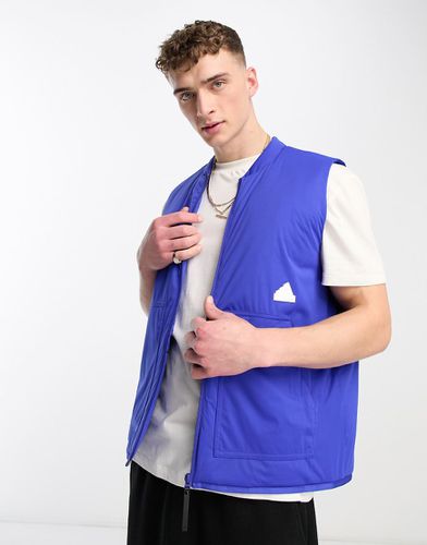 Adidas - Sportswear Future Lounge - Gilet imbottito blu con logo gommato - adidas performance - Modalova