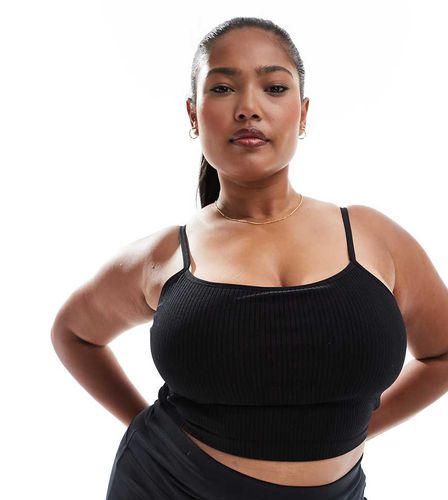 Curve - Icon - Canotta da yoga nera a coste senza cuciture con reggiseno interno - ASOS - Modalova