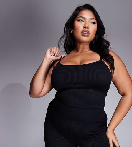 Curve - Icon - Canotta da yoga nera a coste senza cuciture con reggiseno interno - ASOS - Modalova