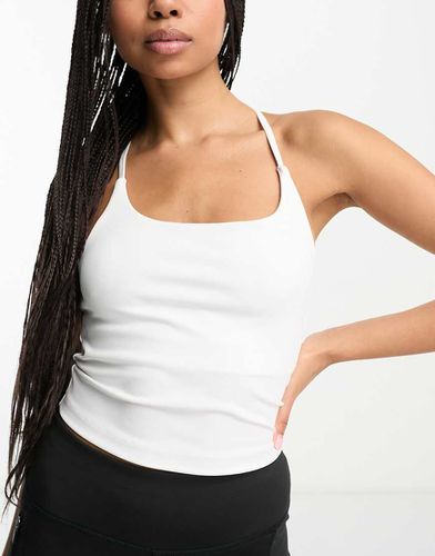 Crop top da yoga con spalline sottili e reggiseno interno - ASOS - Modalova