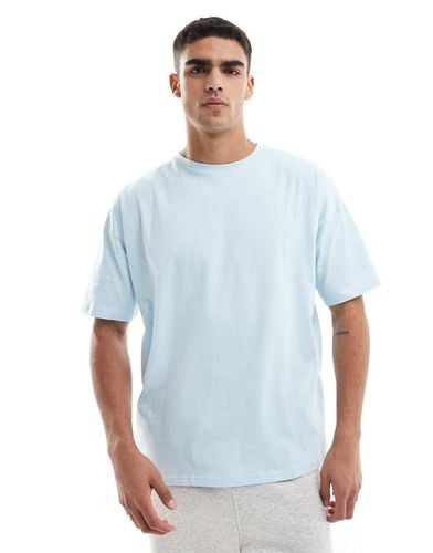 Icon - T-shirt da allenamento oversize chiaro ad asciugatura rapida con logo - ASOS - Modalova