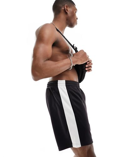 Pantaloncini da allenamento in jersey neri con riga laterale a contrasto - ASOS - Modalova