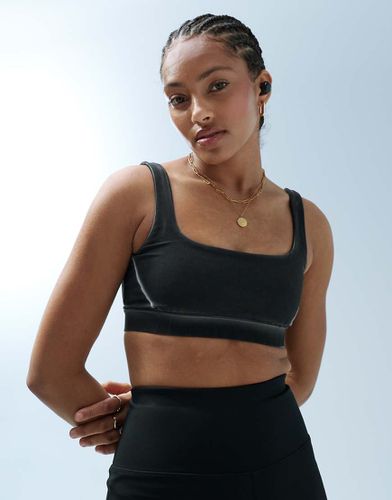 Reggiseno sportivo a sostegno medio slavato con scollo squadrato - ASOS - Modalova