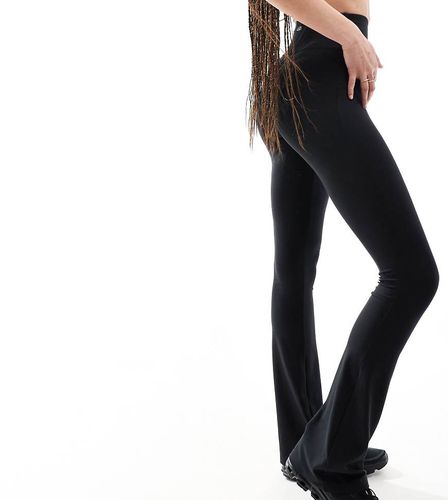 Tall - Icon - Leggings da yoga a zampa neri slim morbidi al tatto - ASOS - Modalova