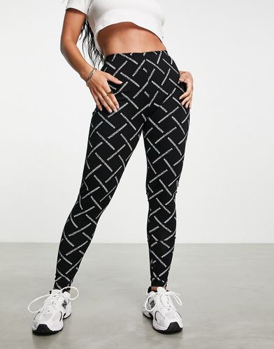 ASOS - Weekend Collective - Leggings neri con monogrammi - ASOS Weekend Collective - Modalova