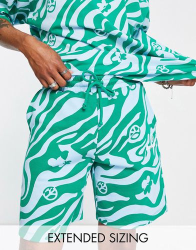 ASOS Daysocial - Pantaloncini comodi e verdi con motivo grafico stampato in coordinato - ASOS DESIGN - Modalova