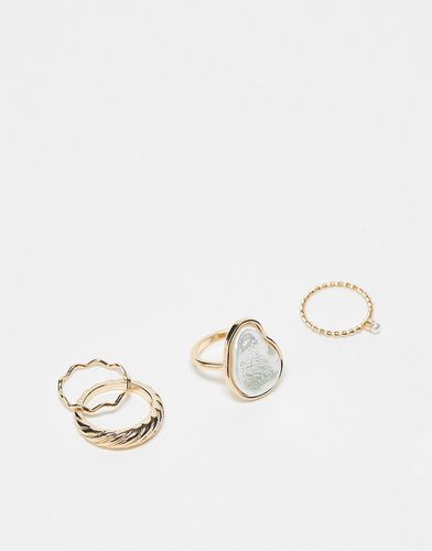 Confezione da 4 anelli dorati con design con perle sintetiche - ASOS DESIGN - Modalova