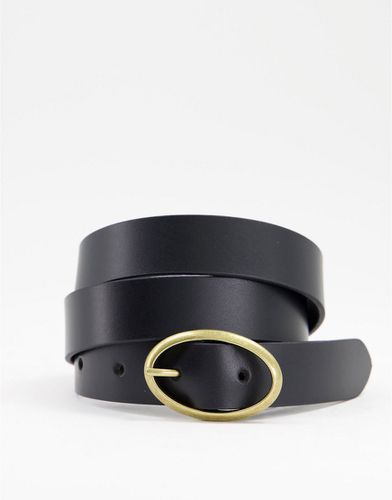 Cintura da jeans per vita e fianchi in pelle nera con fibbia ovale - ASOS DESIGN - Modalova