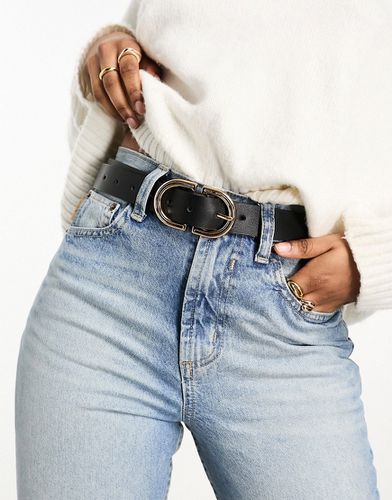 Cintura da jeans per vita e fianchi nera con fibbia oro - ASOS DESIGN - Modalova