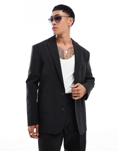 Giacca da abito tecnica nera comoda - ASOS DESIGN - Modalova