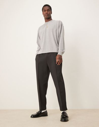 Joggers vestibilità comoda affusolati in tessuto scuba neri con pinces - ASOS DESIGN - Modalova