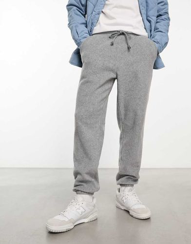 Joggers affusolati grigi felpati - ASOS DESIGN - Modalova