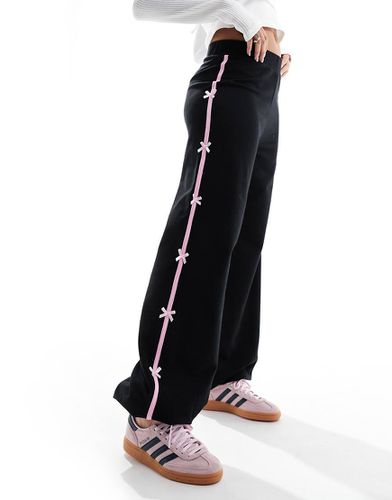 Joggers neri con riga laterale e fiocchi - ASOS DESIGN - Modalova