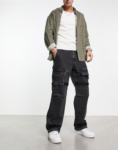 Jeans a fondo ampio nero slavato stile cargo - ASOS DESIGN - Modalova