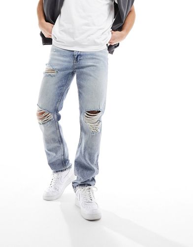Jeans dritti lavaggio chiaro con strappi vistosi - ASOS DESIGN - Modalova