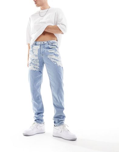 Jeans skinny lavaggio chiaro con strappi vistosi - ASOS DESIGN - Modalova