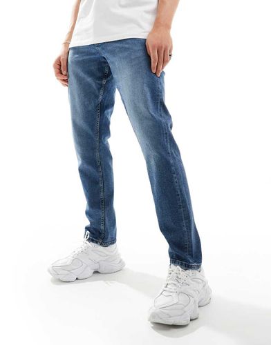 Jeans slim lavaggio medio - ASOS DESIGN - Modalova