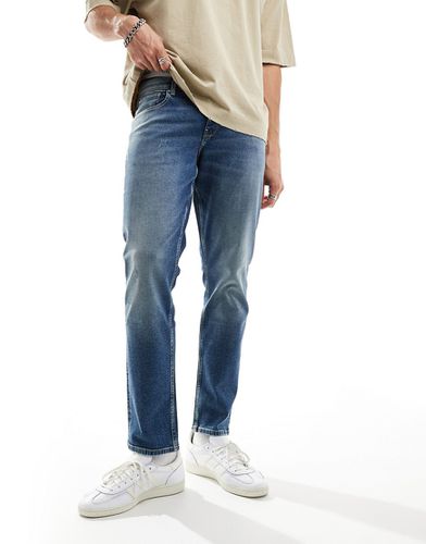 Jeans slim lavaggio medio - ASOS DESIGN - Modalova